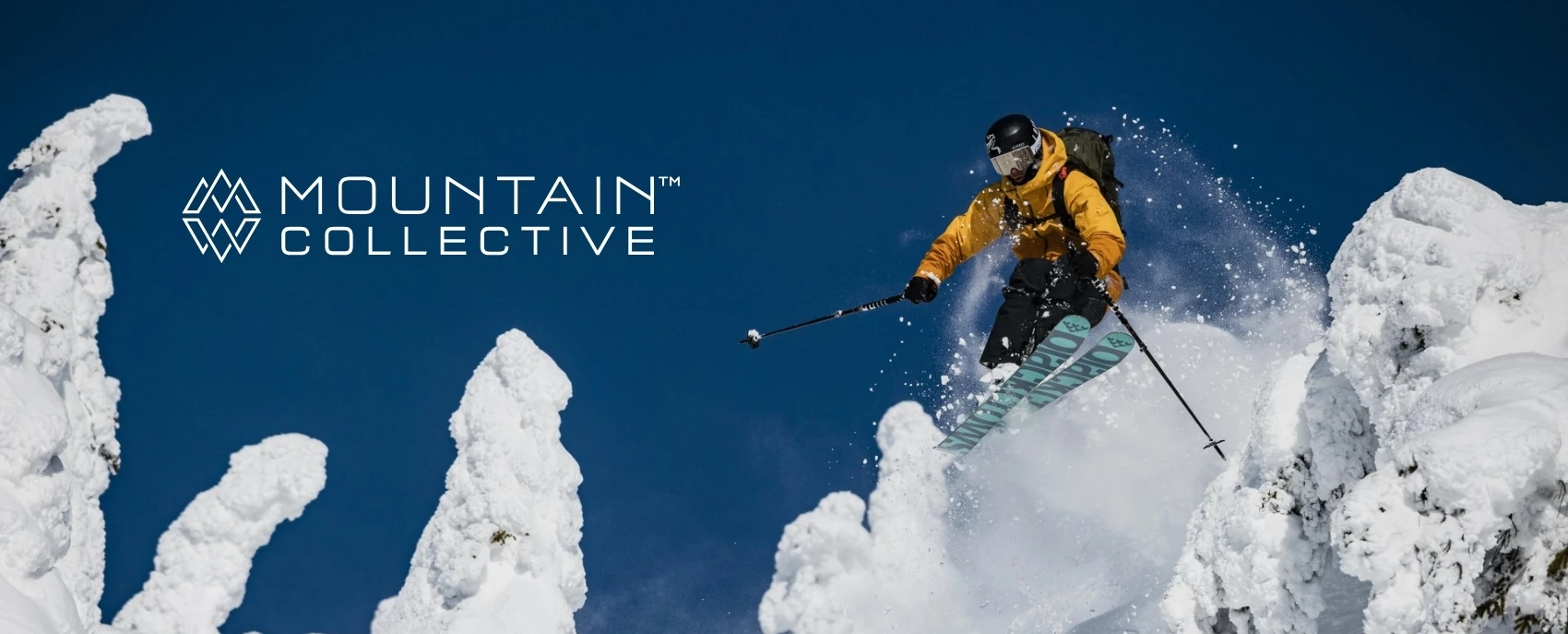 Thrilling skier slashing through untouched snow at Revelstoke, showcasing the benefits of the Mountain Collective pass