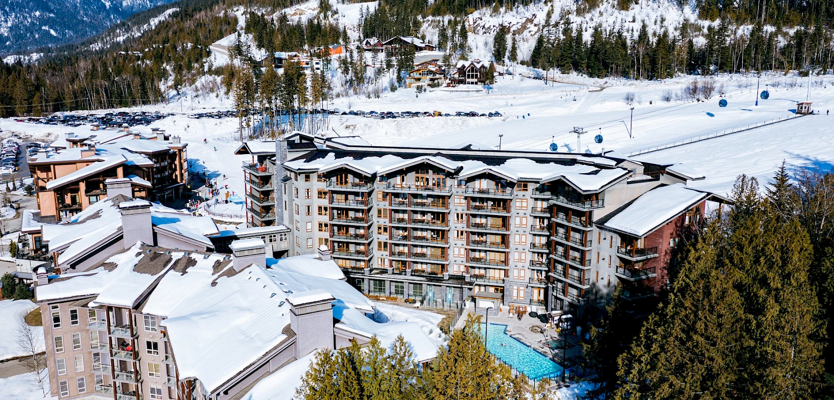 Ski-in ski-out resort with outdoor pool and gondola at mountain base